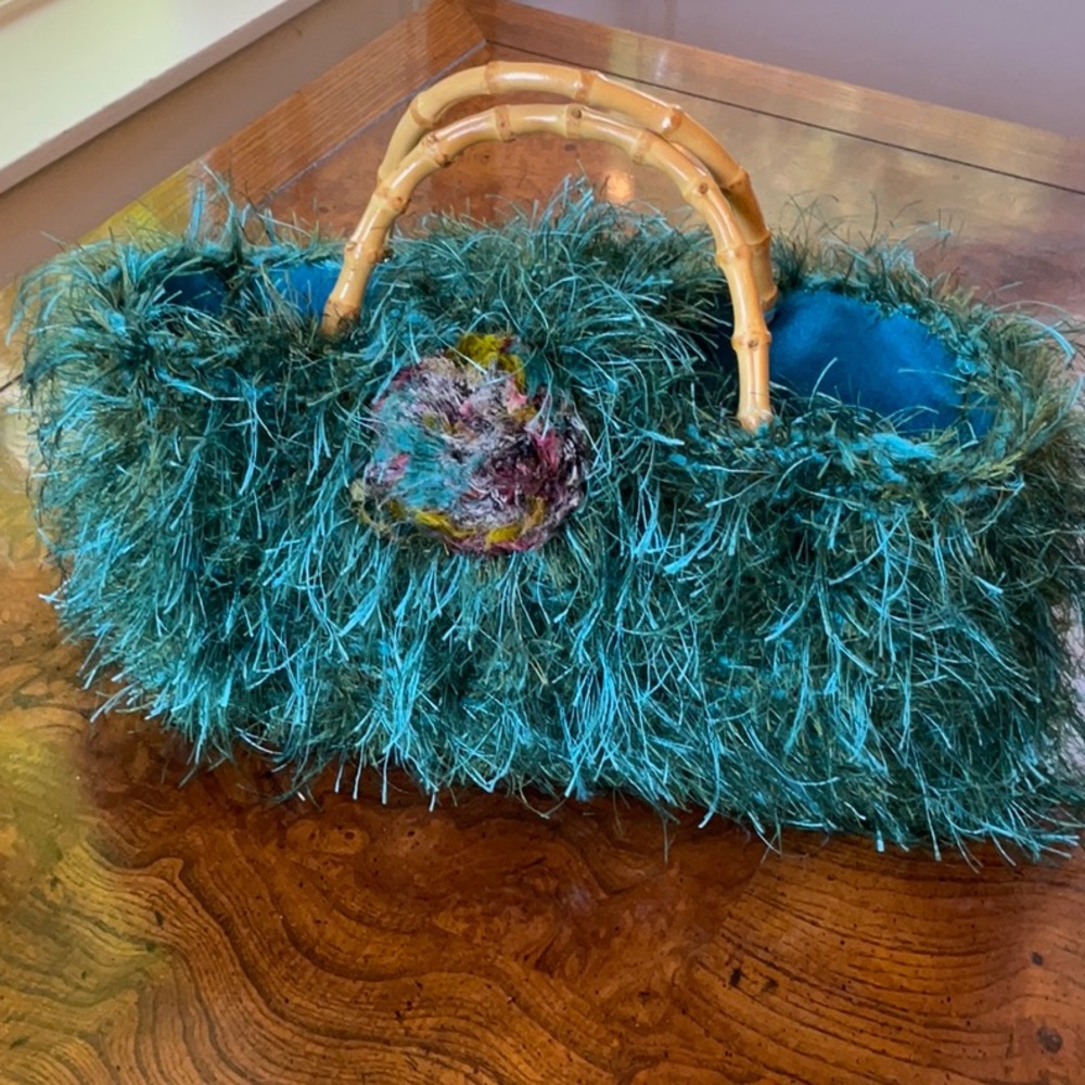 Funky, hand-crafted turquoise handbag with bamboo handles.